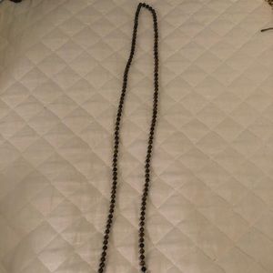 long brown beaded necklace